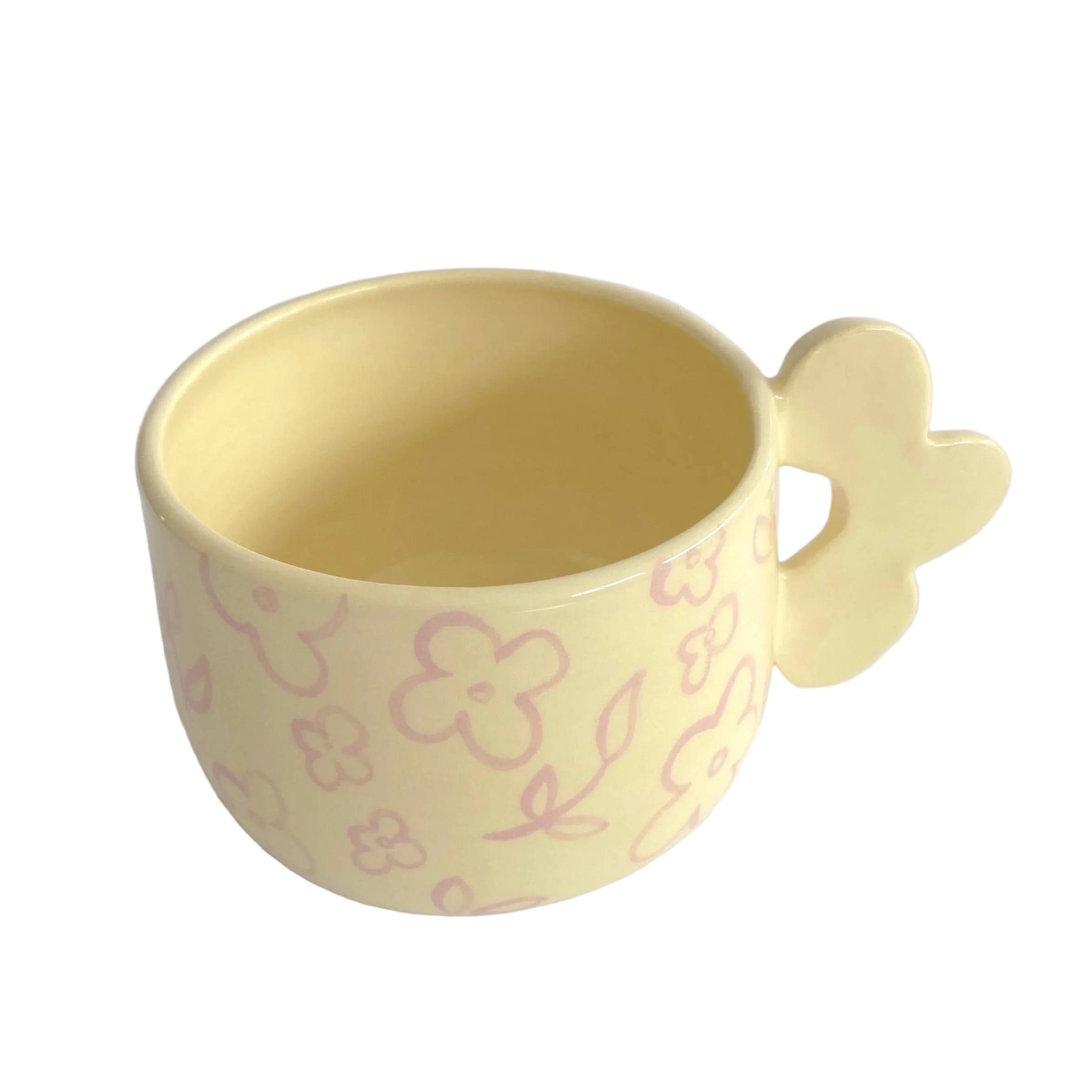 taza de ceramica de color amarillo pastel con flores pintadas y asa de flor de pipa and happy