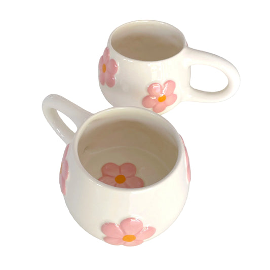 tazas con flores en relieve de color rosa pastel 